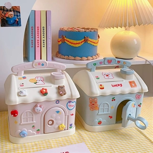 Cute house-shaped plastic money box in pink and blue with a carry handle and key