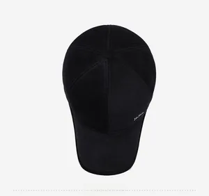 Top view of black winter baseball cap featuring textured fabric and metal detail