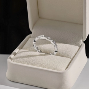 Macro detail of S925 sterling silver stamp and sparkling cubic zirconia stones in a box