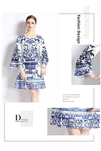 Detail of blue and white floral porcelain print and elegant flare sleeves on the dress