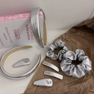 Eight-piece silver Y2K hair accessory set with metallic scrunchies and star hair clips
