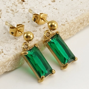 18K gold stainless steel earrings with emerald-cut green zircon on stone background