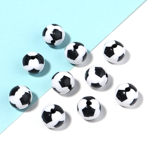 Macro shot of 12mm black and white soccer pattern acrylic beads for DIY jewelry making
