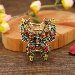 Vintage butterfly hair claw with colorful enamel flowers and crystals on metal clip