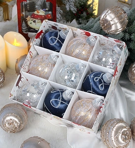 Close-up of 8cm blue, gold, and transparent Christmas ornaments in a 9-compartment gift box