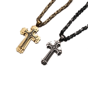 Dual-layer cross pendants in gold and black with Byzantine chain on white backdrop