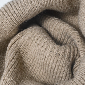 Thick ribbed knit beanie for men and women in warm camel brown with soft wool texture