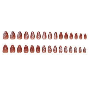 Dark caramel almond press-on nails with white stars and 3D pearl embellishments