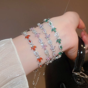 Macro shot of sparkling marquise-cut zircon leaf bracelets in four vibrant colors