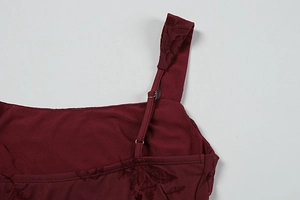Detail of adjustable straps and burnout floral pattern on the wine red summer maxi dress