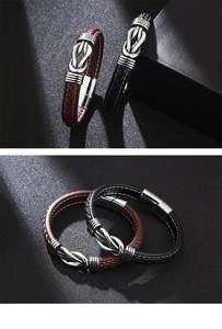 Close-up of brown and black braided leather bracelets with silver magnetic clasp closures