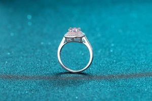 Detail of S925 silver ring featuring a pink round stone with double halo setting