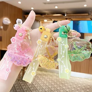 Colorful shell drifting bottle keychain with flowing sand and silicone strap for bags