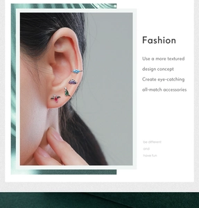 Detailed close-up of S925 sterling silver dinosaur stud earrings with colorful zircon