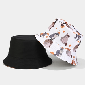 Reversible bucket hat with cartoon cat print and solid black design for sun protection