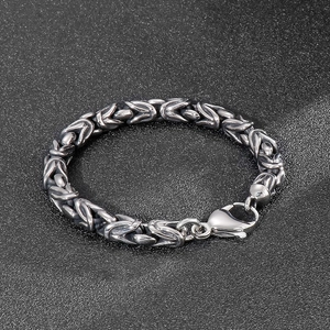 Macro detail of men's Byzantine chain link bracelet with heavy duty lobster clasp