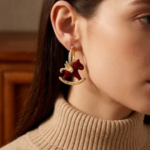 Exquisite rocking horse pendant earrings with red enamel and gold wings for women