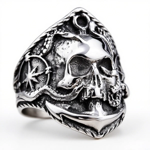 Detailed macro shot of vintage nautical ring with anchor, skull and octopus carvings