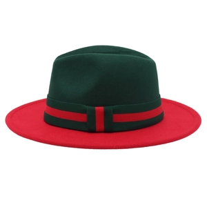 Detail of red and green two-tone wide brim fedora hat with striped ribbon band
