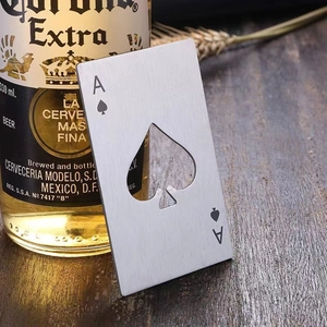 Macro view of silver stainless steel Ace of Spades poker bottle opener on a table