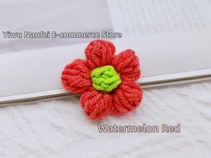 Macro detail of handmade crochet flower in watermelon red for DIY hair accessories