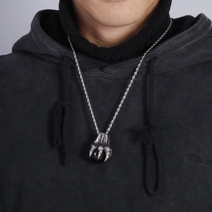 Punk style stainless steel dragon claw pendant with black orb on a twisted rope chain