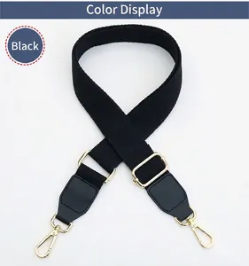 Adjustable wide black canvas shoulder strap with gold metal hooks for cross-body bags