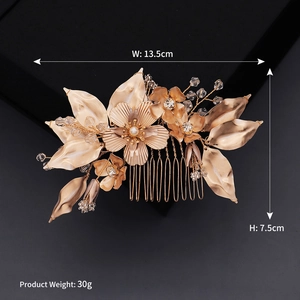 Detailed view of bridal hair comb with gold flowers, pearls, and rhinestones, 13.5cm width
