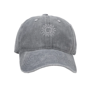 Close-up of sun and moon embroidery on a washed dark gray vintage baseball cap