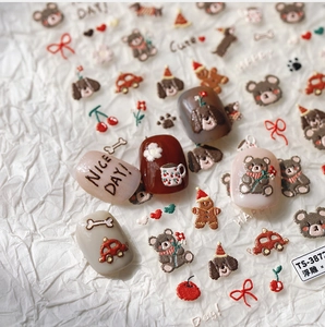 Macro detail of 5D embossed nail stickers featuring cute cartoon bears and vintage cars