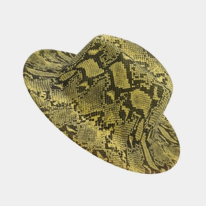 Detailed view of the yellow snake skin pattern and texture on a classic wool fedora hat