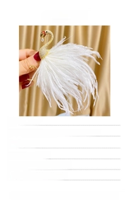 Detailed view of elegant white flamingo brooch with zircons and ostrich feathers