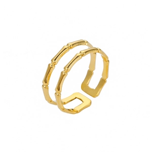 Detailed shot of double-layered gold-plated bamboo texture open ring with polished finish