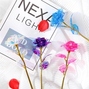 Detail view of colorful gold foil roses in blue, purple, and pink with golden stems