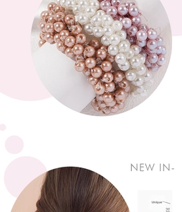 Detail of elegant faux pearl elastic hair ties in champagne, white and pink colors