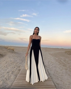 Detail view of monochrome black and white long dress with elegant slim waist design