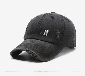 Detail of vintage washed dark grey baseball cap with white Boston embroidery