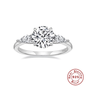 Close-up of S925 sterling silver stamp on a three-stone engagement ring band