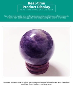 Close-up of a natural amethyst crystal sphere on a tiered dark red wooden display stand