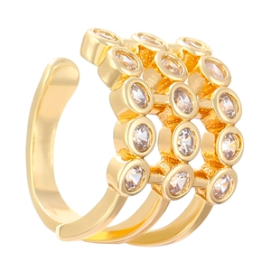 Detailed macro shot of triple-layer gold ear cuff set with sparkling zircon stones