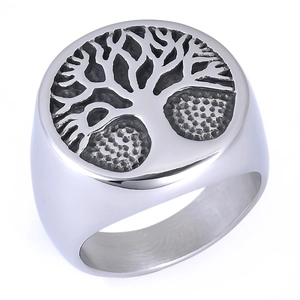 Macro detail of silver tree of life engraving on a stainless steel signet ring for men