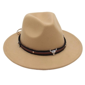 Close-up of khaki wool fedora featuring a silver bull head metal buckle on a leather band
