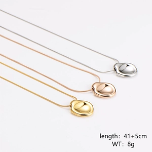 Minimalist irregular concave pendant necklace in gold, silver, and rose gold finishes