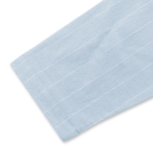 Detail shot of light blue vertical stripe shirt cuff with high-quality stitching and fabric