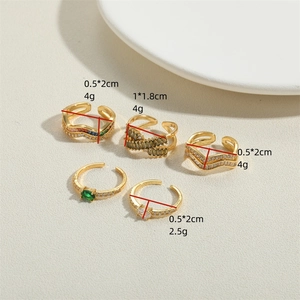 Five gold plated zircon open rings set with sparkling clear and colored gemstones