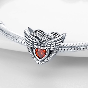 Silver heart angel wing charm with red gemstone and crystals on a beaded bracelet