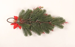 Close-up of Christmas teardrop swag with red poinsettia, gold ornaments and pine needles