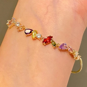 18k gold plated bracelet featuring colorful square zircon stones worn on a female wrist