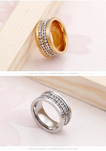 Close-up of triple-row crystal set on gold and silver titanium steel wedding rings