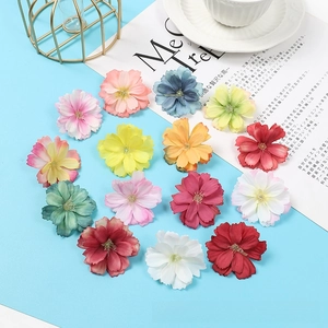 Detailed top view of colorful artificial plum blossoms for DIY crafts and accessories